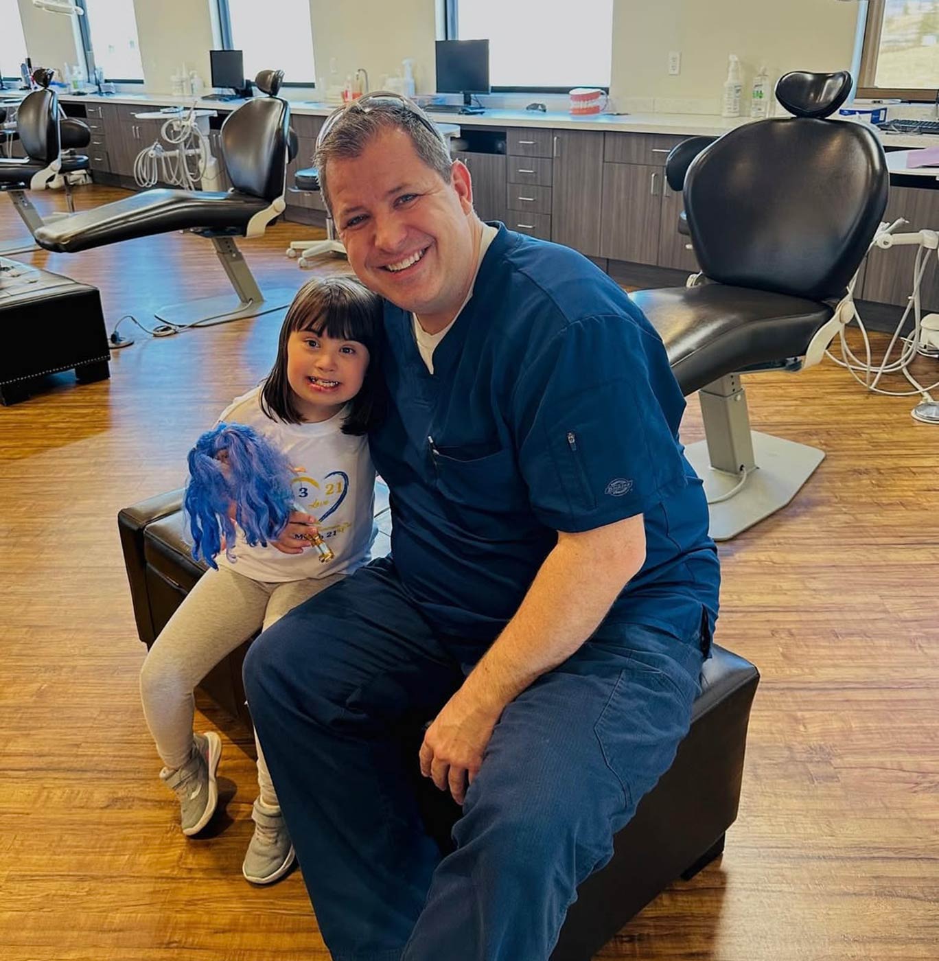 Dr. Josh with smiling girl patient
